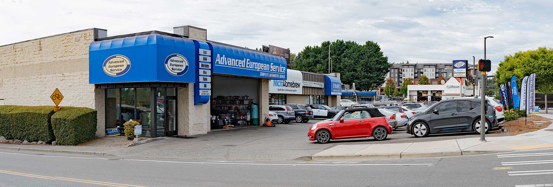European car repair service with parked vehicles
