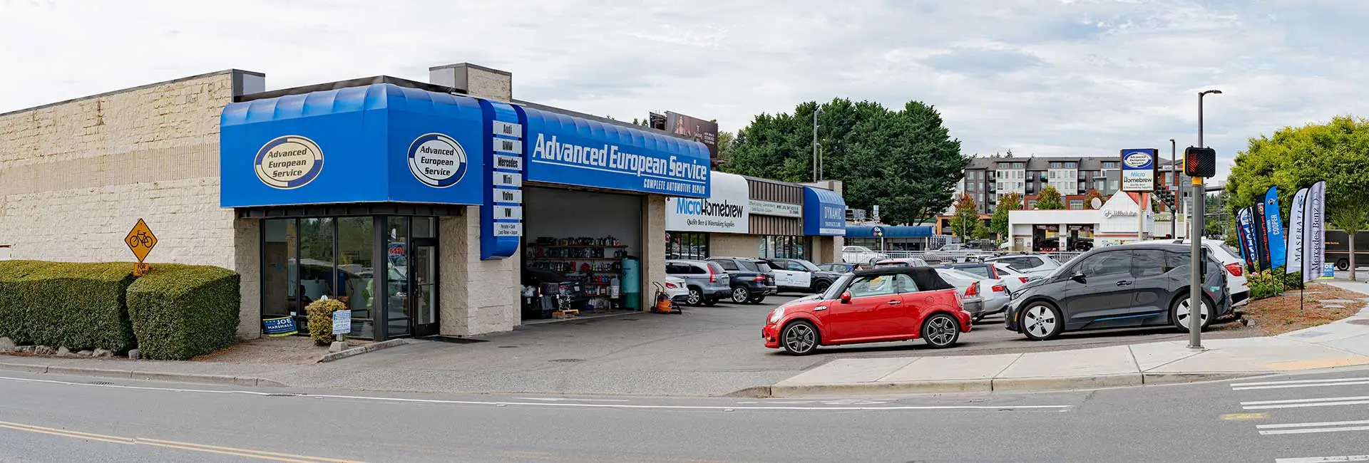 European car repair service with parked vehicles